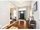 Welcoming foyer with hardwood floors, decorative lighting, and a view into the adjacent living spaces at 14003 Grannan Ln, Carmel, IN 46074