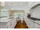 Bright kitchen features granite countertops, stainless steel appliances and hardwood floors at 14003 Grannan Ln, Carmel, IN 46074