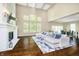 Spacious living room with a fireplace, large windows, and an open design for comfortable living at 14003 Grannan Ln, Carmel, IN 46074