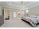 Spacious main bedroom with tray ceiling and large windows providing natural light at 14003 Grannan Ln, Carmel, IN 46074
