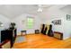 Bright bonus room features hardwood floors, neutral paint, and ample sunlight at 1409 Alimingo Dr, Indianapolis, IN 46260