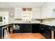 Charming kitchen featuring granite countertops, a garden window, stainless steel appliances, and white cabinets at 1409 Alimingo Dr, Indianapolis, IN 46260