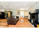 Inviting living room featuring a fireplace, a leather sofa, and ample space for relaxation at 1409 Alimingo Dr, Indianapolis, IN 46260