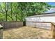 This beautiful wooden deck offers an outdoor living space perfect for entertaining and enjoying the scenery in this backyard at 1421 Laurel St, Indianapolis, IN 46203
