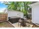 Backyard featuring a hot tub, grill and outdoor table creating a relaxing space for outdoor entertaining and leisure at 1421 Laurel St, Indianapolis, IN 46203