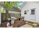 This backyard features a grill and propane tank, perfect for outdoor cooking and entertaining, plus a table for preparing at 1421 Laurel St, Indianapolis, IN 46203