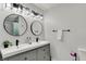Modern bathroom features dual sinks, sleek fixtures, and updated lighting at 1421 Laurel St, Indianapolis, IN 46203