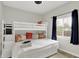 Charming bedroom features a fun bunk bed, soft carpet, and a large window for natural light at 1421 Laurel St, Indianapolis, IN 46203