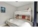 Comfortable bedroom includes a bunk bed, soft carpet, and neutral paint at 1421 Laurel St, Indianapolis, IN 46203