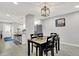 Bright dining room features hardwood floors, a modern light fixture, and stylish black chairs at 1421 Laurel St, Indianapolis, IN 46203
