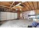 Spacious garage with an unfinished interior, providing ample storage space and a workbench at 1421 Laurel St, Indianapolis, IN 46203