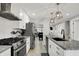 Sleek kitchen with stainless steel appliances and granite countertops offers a modern cooking experience at 1421 Laurel St, Indianapolis, IN 46203