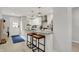 Bright, updated kitchen boasts granite countertops, stainless appliances, and barstool seating at the breakfast bar at 1421 Laurel St, Indianapolis, IN 46203