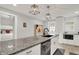 Bright kitchen island with granite countertops and stylish pendant lighting, ready for cooking at 1421 Laurel St, Indianapolis, IN 46203