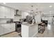 Modern kitchen with stainless steel appliances, granite countertops, and a stylish backsplash at 1421 Laurel St, Indianapolis, IN 46203
