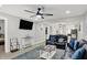 Open concept living room featuring contemporary decor, a ceiling fan, and stylish flooring at 1421 Laurel St, Indianapolis, IN 46203