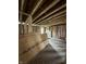 Bedroom under construction with exposed wood framing, insulation, and plywood sheets at 1503 E 20Th St, Muncie, IN 47302