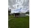 Cozy single-story home featuring a red front door and ample green lawn space at 1503 E 20Th St, Muncie, IN 47302