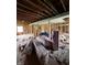 Unfinished living room with exposed framing, insulation rolls, and scattered construction materials at 1503 E 20Th St, Muncie, IN 47302