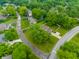 A lovely neighborhood with mature trees and well-maintained lawns surrounds this beautiful home at 15203 Shoreway Ct, Carmel, IN 46032