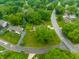 Overhead view of a home with a large lawn and mature trees in a residential neighborhood at 15203 Shoreway Ct, Carmel, IN 46032
