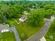 Aerial shot of a home with a spacious yard, mature trees, and neighborhood streets at 15203 Shoreway Ct, Carmel, IN 46032
