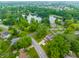 A tranquil lake and lush greenery surround this serene neighborhood, offering a peaceful living environment at 15203 Shoreway Ct, Carmel, IN 46032