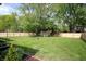 Expansive backyard featuring a shed and a well-maintained lawn, enclosed by a new wooden fence at 15203 Shoreway Ct, Carmel, IN 46032