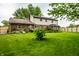 Expansive backyard featuring lush lawn, mature trees, and a charming gazebo at 15203 Shoreway Ct, Carmel, IN 46032