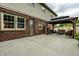 Brick house with a covered patio, complete with an outdoor seating area at 15203 Shoreway Ct, Carmel, IN 46032