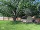 Backyard with large tree and lawn, perfect for outdoor activities at 15203 Shoreway Ct, Carmel, IN 46032