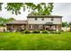 Well-maintained backyard with green grass, patio, and gazebo for outdoor enjoyment at 15203 Shoreway Ct, Carmel, IN 46032