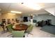 Spacious finished basement featuring multiple lounge areas, a foosball table, and tv at 15203 Shoreway Ct, Carmel, IN 46032