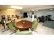 Finished basement featuring a table with green chairs, pool table, and open space with sofa and exercise equipment at 15203 Shoreway Ct, Carmel, IN 46032