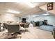 Spacious carpeted basement with a game table, living area, and gym at 15203 Shoreway Ct, Carmel, IN 46032
