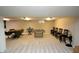 Large finished basement featuring a foosball table, seating area, and entertainment space at 15203 Shoreway Ct, Carmel, IN 46032