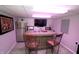 Finished basement featuring a wet bar area with comfortable seating, TV, and modern appliances at 15203 Shoreway Ct, Carmel, IN 46032