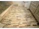 Beautifully remodeled bathroom features neutral tiled floors, modern vanity, and a shower with a glass door at 15203 Shoreway Ct, Carmel, IN 46032