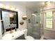 Modern bathroom features stylish tile, sleek fixtures, and a glass-enclosed shower at 15203 Shoreway Ct, Carmel, IN 46032