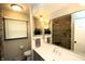 Modern bathroom with a gray vanity, quartz countertop, and glass enclosed shower with tiled walls at 15203 Shoreway Ct, Carmel, IN 46032