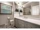 The bathroom features a modern vanity with a white countertop, tiled floor and shower, and natural light at 15203 Shoreway Ct, Carmel, IN 46032