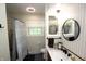 Bathroom featuring a shower/tub combination, modern fixtures, white quartz countertops and a round mirror at 15203 Shoreway Ct, Carmel, IN 46032