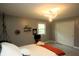 Bright bedroom with carpet, light grey walls, double closet doors, and a modern light fixture at 15203 Shoreway Ct, Carmel, IN 46032