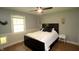 Cozy bedroom with wood floors, bright window, a queen size bed and ceiling fan at 15203 Shoreway Ct, Carmel, IN 46032