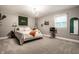 This comfortable bedroom has lots of natural light, a unique bed, and fun decorative elements at 15203 Shoreway Ct, Carmel, IN 46032