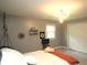 Unique bedroom featuring a decorative light fixture, minimalist decor, and a cozy hanging chair at 15203 Shoreway Ct, Carmel, IN 46032