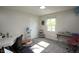Bright bedroom with white walls, a desk, and a window that lets in natural light at 15203 Shoreway Ct, Carmel, IN 46032