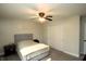 Bedroom featuring ceiling fan, closet, light walls, and neutral colored bedding at 15203 Shoreway Ct, Carmel, IN 46032