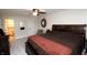 Spacious bedroom with neutral walls, carpeted floors, ceiling fan, and access to the Primary bathroom at 15203 Shoreway Ct, Carmel, IN 46032