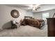 Cozy bedroom with dark wood furniture, neutral carpet, and natural light at 15203 Shoreway Ct, Carmel, IN 46032